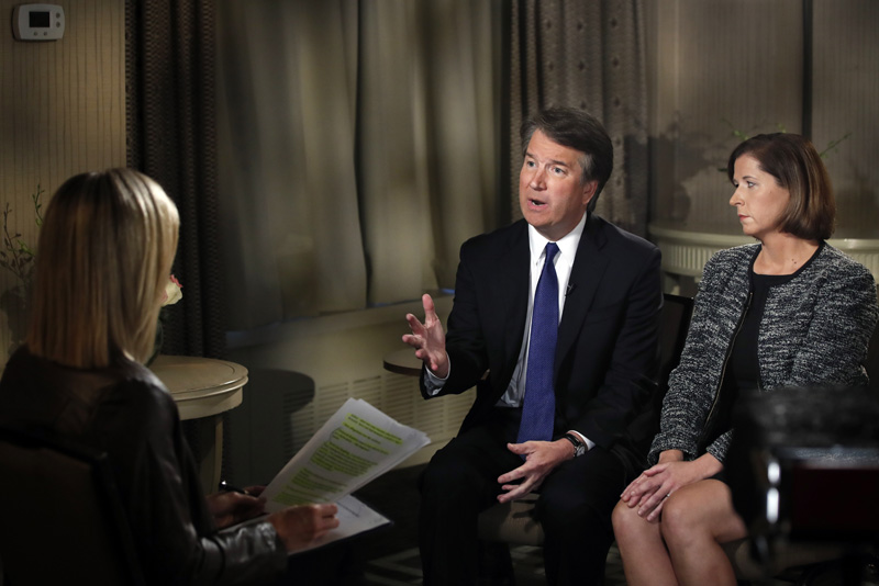 Brett Kavanaugh and his wife Ashley Kavanaugh answer questions during a FOX News interview with Martha MacCallum, Monday, Sept. 24, 2018, in Washington, about allegations of sexual misconduct against the Supreme Court nominee. (AP Photo/Jacquelyn Martin)