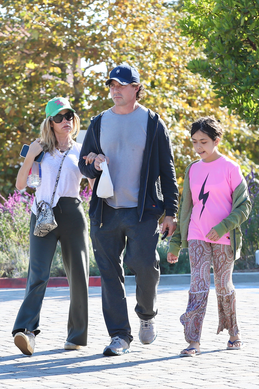 *EXCLUSIVE* Denise Richards and her husband Aaron Phypers walk arm-in-arm as they shop in Malibu