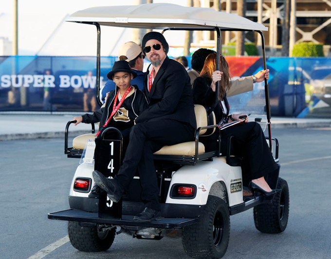 Brad Pitt with his son Maddox arrive for Super Bowl XLIV