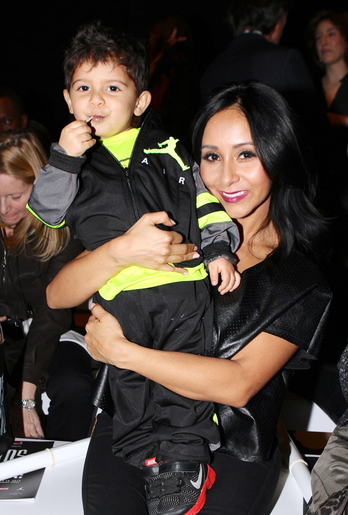 Snooki Holding Lorenzo at a 2015 Fashion Event