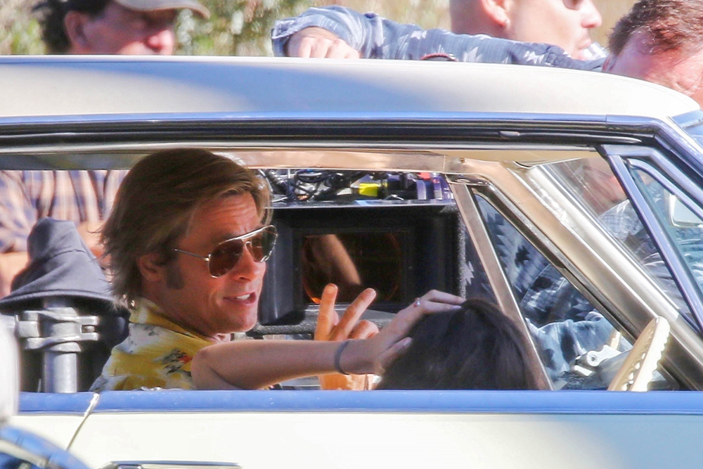 ** RIGHTS: WORLDWIDE EXCEPT IN ITALY ** Los Angeles, CA  - *EXCLUSIVE*  - Brad Pitt and Margaret Qualley are seen behind the scenes as they film "Once Upon a Time in Hollywood". Director Quinten Tarentino looks on as the two film a steamy scene in an old Cadillac for the star studded movie.

Pictured: Brad Pitt, Margaret Qualley

BACKGRID USA 20 OCTOBER 2018 

USA: +1 310 798 9111 / usasales@backgrid.com

UK: +44 208 344 2007 / uksales@backgrid.com

*UK Clients - Pictures Containing Children
Please Pixelate Face Prior To Publication*