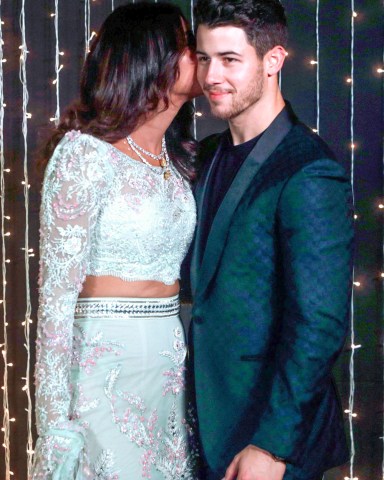 Bollywood actress Priyanka Chopra and musician Nick Jonas pose for photographs at their wedding reception in Mumbai, India
Chopra Jonas Wedding, Mumbai, India - 20 Dec 2018