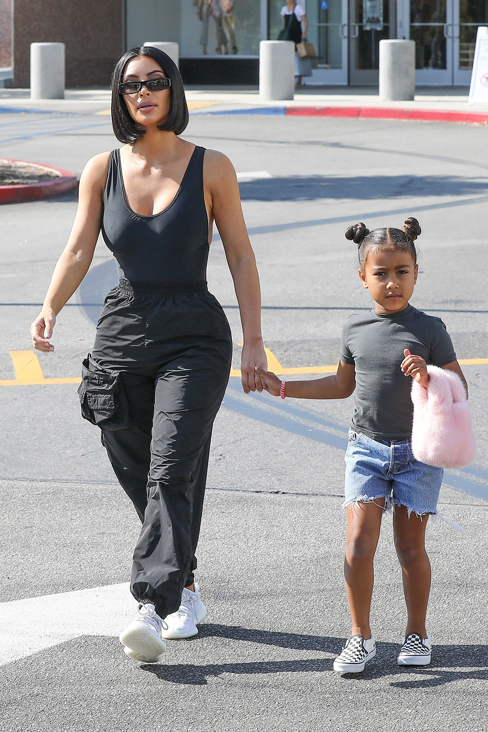 Calabasas, CA  - *EXCLUSIVE*  - Kim Kardashian and daughter North West held hands as they enjoyed a mommy/daughter shopping date with friends at the Neiman Marcus in Calabasas. Kim showed off her wasp waist in a black tank top and cargo pants, while North was adorable with her hair in two mini buns.

Pictured: Kim Kardashian, North West

BACKGRID USA 31 JULY 2018 

BYLINE MUST READ: BAHE / BACKGRID

USA: +1 310 798 9111 / usasales@backgrid.com

UK: +44 208 344 2007 / uksales@backgrid.com

*UK Clients - Pictures Containing Children
Please Pixelate Face Prior To Publication*