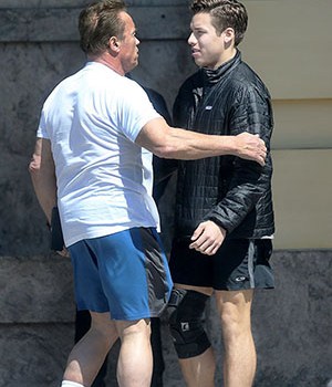 EXCLUSIVE: Arnold Schwarzenegger met son Joseph Baena for lunch at the Fairmont Hotel in Santa Monica minutes before Baena went to the same medical clinic as Schwarzenegger to get his leg brace removed in Hawthorne. 14 Mar 2018 Pictured: Joseph Baena and Arnold Schwarzenegger. Photo credit: MB / MEGA TheMegaAgency.com +1 888 505 6342 (Mega Agency TagID: MEGA182428_001.jpg) [Photo via Mega Agency]