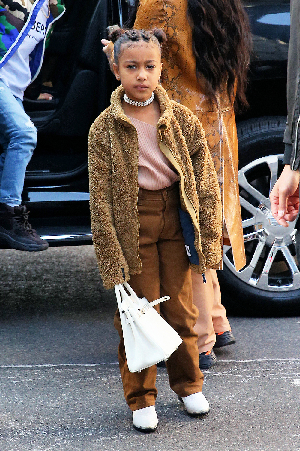 Kim Kardashian Gets In Some Last Minute Christmas Shopping With North West And Saint West At Saks Fifth Avenue In NYC