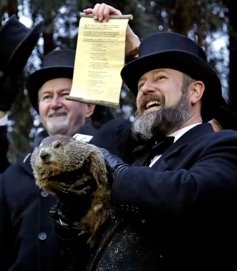 John Griffiths Al Dereume. Groundhog Club co-handler Al Dereume, right, holds Punxsutawney Phil, the weather prognosticating groundhog, during the 133rd celebration of Groundhog Day on Gobbler's Knob in Punxsutawney, Pa. . Phil's handlers said that the groundhog has forecast an early spring
Groundhog Day, Punxsutawney, USA - 02 Feb 2019