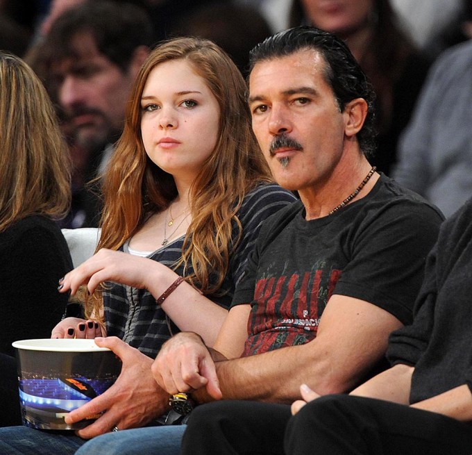 Antonio Banderas and Stella Banderas at a basketball game