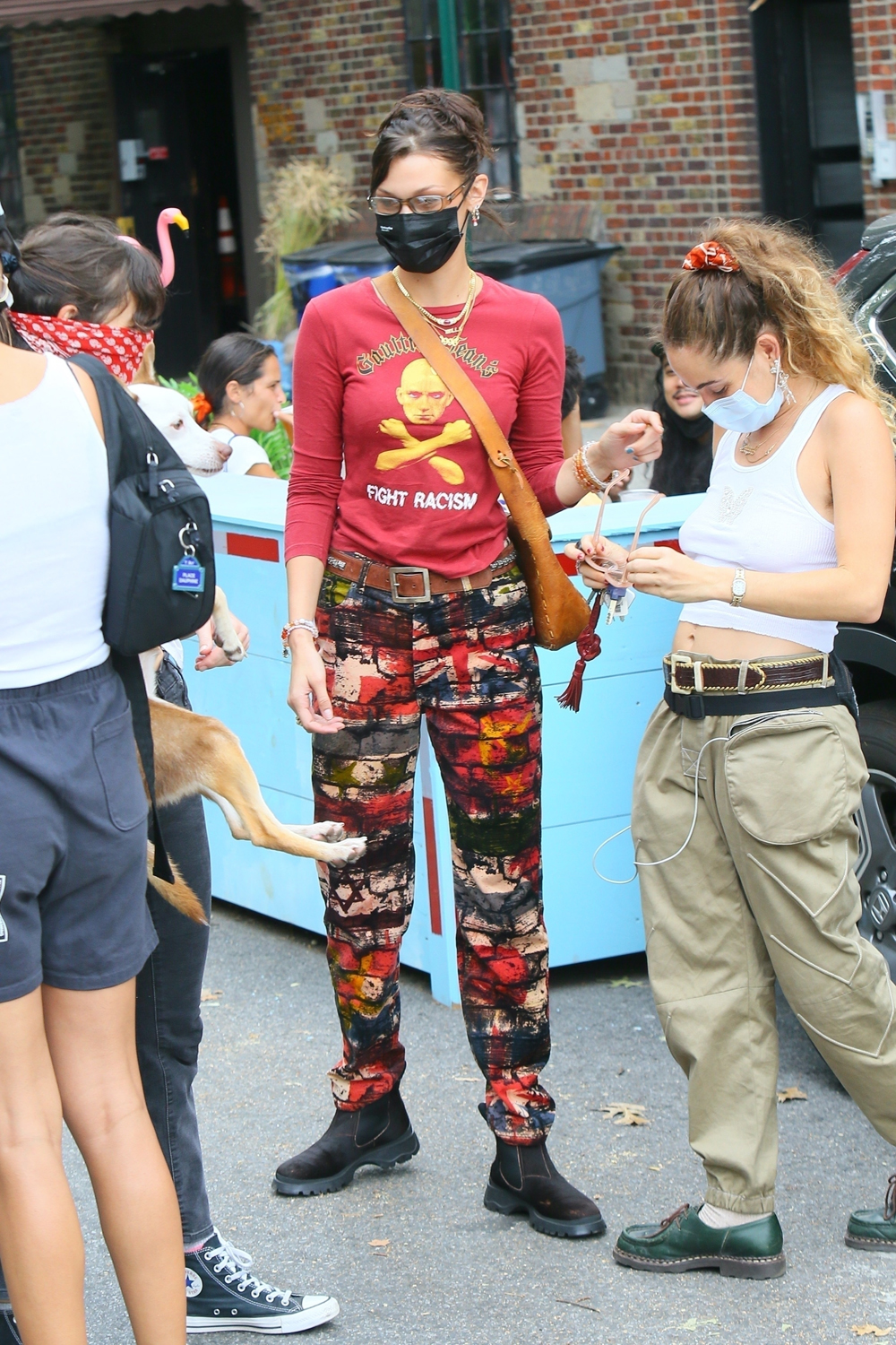 New York, NY  - *EXCLUSIVE*  - Bella Hadid heads to Brooklyn to shop at the Sidewalk Sale for Social Justice in Brooklyn benefiting the Black Lives Matter movement. The top model who recently became an aunt sported a a Gaultier Jeans red top that read Fight Racism and printed pants with a vintage crossbody leather bag. Bella accessorized with multiple strands of necklaces including a nameplate necklace and another that paid homage to the year of her birth, 1996. The model donated items to the event and made sure to pick up something for herself as well. *Shot on September 27, 2020*

Pictured: Bella Hadid

BACKGRID USA 28 SEPTEMBER 2020 

USA: +1 310 798 9111 / usasales@backgrid.com

UK: +44 208 344 2007 / uksales@backgrid.com

*UK Clients - Pictures Containing Children
Please Pixelate Face Prior To Publication*