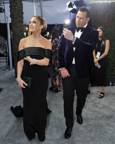 Jennifer Lopez, left, and Alex Rodriguez arrive at the 26th annual Screen Actors Guild Awards at the Shrine Auditorium & Expo Hall on Sunday, Jan. 19, 2020, in Los Angeles. (Photo by Richard Shotwell/Invision/AP)