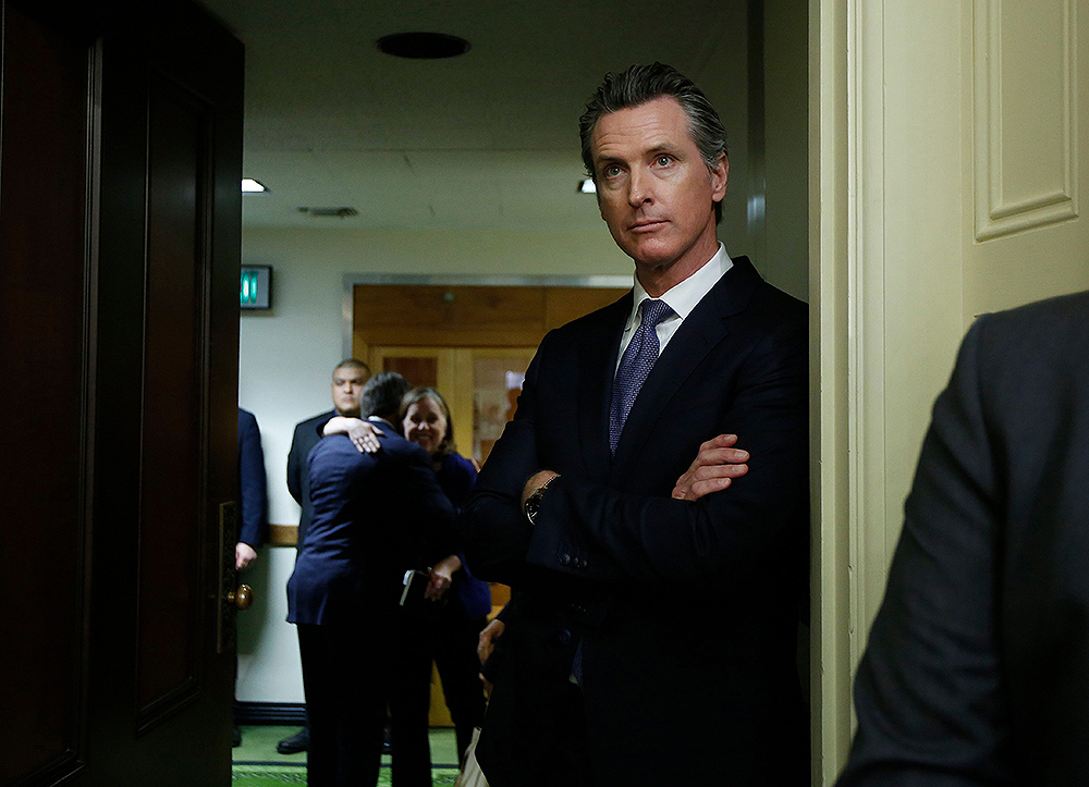 Governor-elect, Lt. Gov. Gavin Newsom, watches the Assembly session at the Capitol, in Sacramento, Calif. All 80 members of the Assembly and half the 40 senators were sworn in Monday
California Legislature, Sacramento, USA - 03 Dec 2018