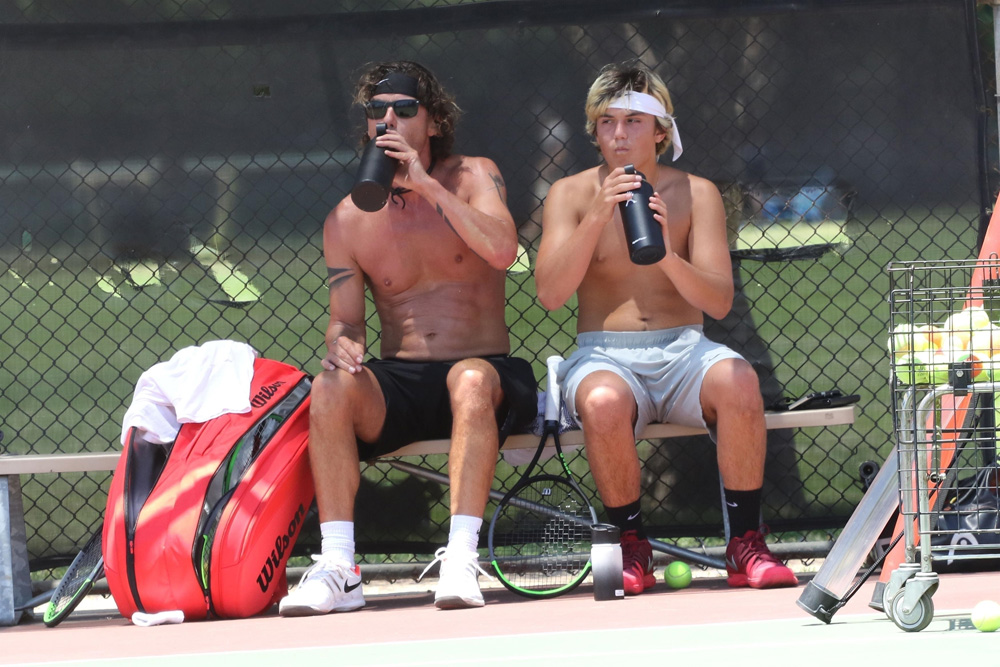 Los Angeles, CA  - *EXCLUSIVE*  - Gavin Rossdale and his son Kingston Rossdale seen shirtless playing tennis on a hot day in LA.  The two take a break together and get water before going at it again. Kingston helps gather balls before the duo put on their masks to leave the courts.

Pictured: Gavin Rossdale, Kingston Rossdale

BACKGRID USA 26 JUNE 2020 

USA: +1 310 798 9111 / usasales@backgrid.com

UK: +44 208 344 2007 / uksales@backgrid.com

*UK Clients - Pictures Containing Children
Please Pixelate Face Prior To Publication*