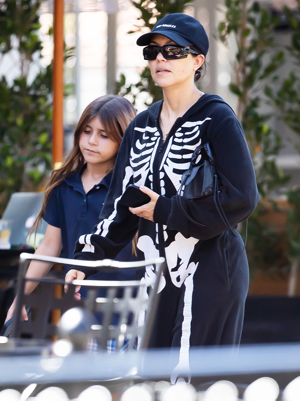 *EXCLUSIVE* Kourtney Kardashian looks like 'death' in a skeleton jumper after marrying Travis Barker (Again!)