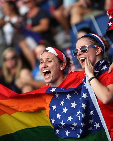 Fans for the U.S. hold up yell as they hold up a rainbow flag prior to the Women's World Cup quarterfinal soccer match between France and the United States at the Parc des Princes, in ParisUS WWCup Soccer, Paris, France - 28 Jun 2019