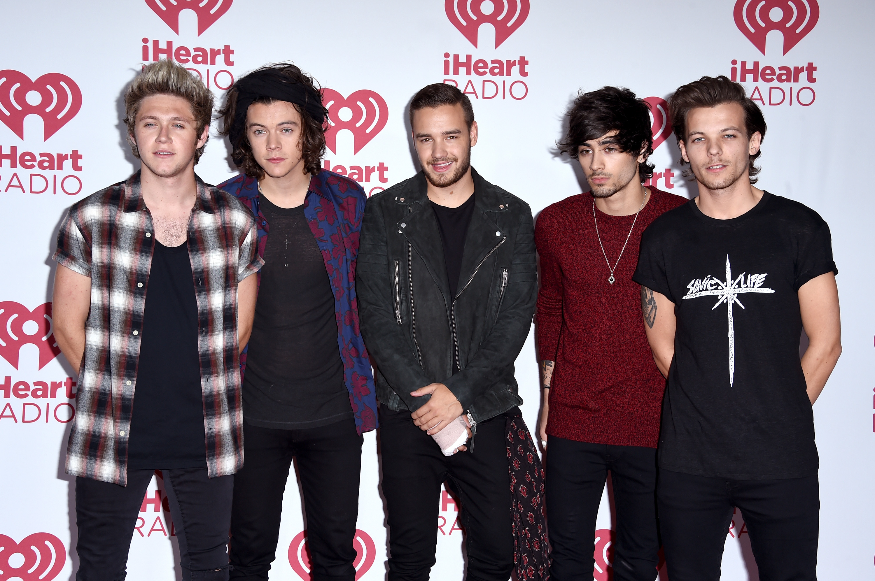 LAS VEGAS, NV - SEPTEMBER 20:  (L-R) Niall Horan, Harry Styles, Liam Payne, Zayn Malik and Louis Tomlinson of One Direction pose in the press room during the 2014 iHeartRadio Music Festival at MGM Grand Garden Arena on September 20, 2014 in Las Vegas, Nevada.  (Photo by Steve Granitz/WireImage)