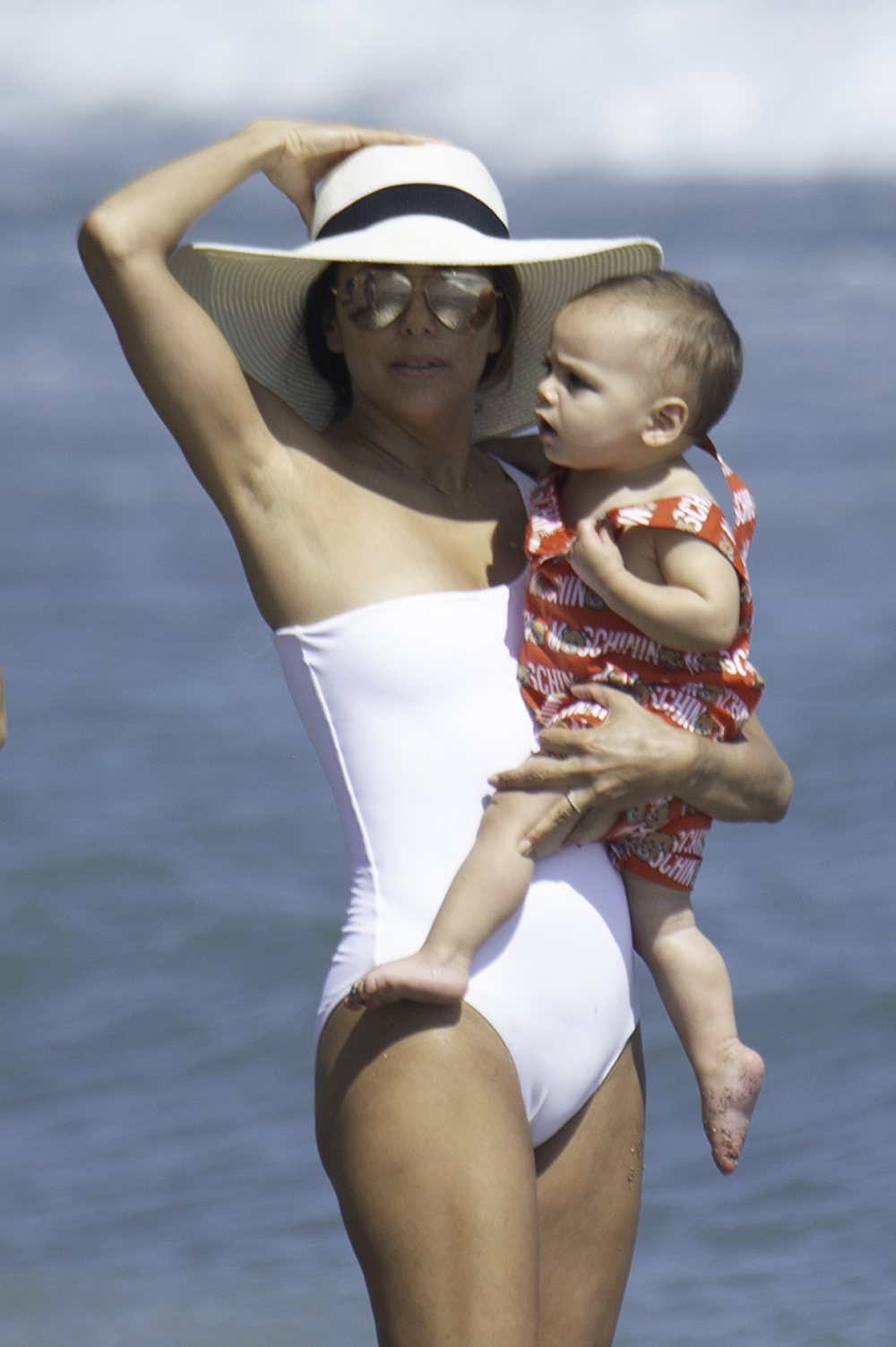 Eva Longoria takes the opportunity to take a walk with her son on the beach and take photos ***SPECIAL INSTRUCTIONS*** Please pixelate children's faces before publication.***. 09 Jul 2019 Pictured: EVA LONGORIA WITH HER SON. Photo credit: MEGA TheMegaAgency.com +1 888 505 6342 (Mega Agency TagID: MEGA462204_004.jpg) [Photo via Mega Agency]