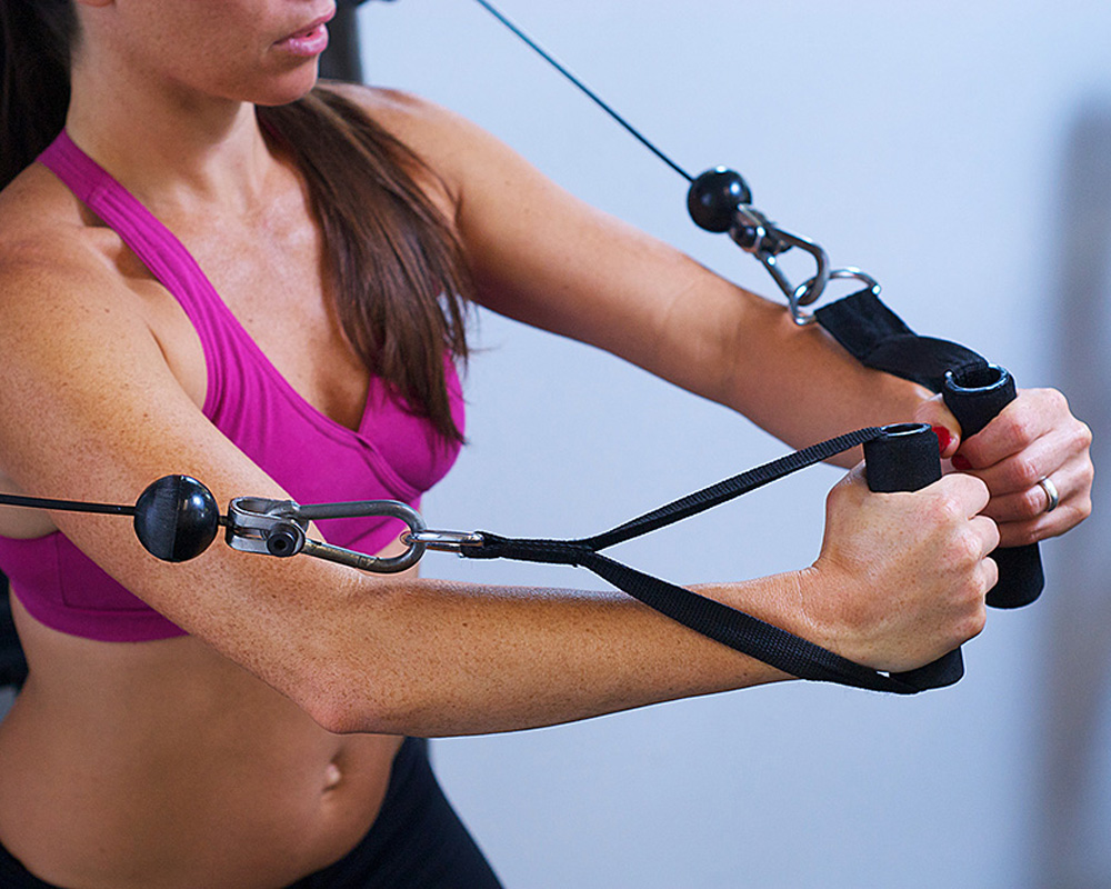 Model Released - Woman using weights during fitness training workout.Gym