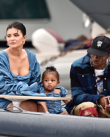 ** RIGHTS: ONLY UNITED STATES, BRAZIL, CANADA ** Portofino, ITALY  - *EXCLUSIVE*  - Kylie Jenner enjoys the day with her adorable daughter Stormy wearing matching denim ruffled dresses by TLZ L'FEMME in Portofino with family. Birthday girl Kylie and Stormy take in the sights with daddy Travis Scott, Scott Disick, Sofia Richie and her mother Kris Jenner and Corey Gamble. The gang arrive at shore via a dinghy ride and strolled through the coastal town of Portofino and turned a few heads with a variety of striking outfits as they go shopping all looking rather glammed up on their Italian break. *Shot on 08/12/19*

Pictured: Kylie Jenner - Travis Scott

BACKGRID USA 13 AUGUST 2019 

BYLINE MUST READ: Cobra Team / BACKGRID

USA: +1 310 798 9111 / usasales@backgrid.com

UK: +44 208 344 2007 / uksales@backgrid.com

*UK Clients - Pictures Containing Children
Please Pixelate Face Prior To Publication*