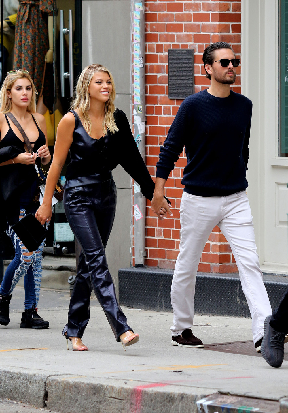 Sofia Richie is all smiles holding hands with Scott Disick while shopping in NYC