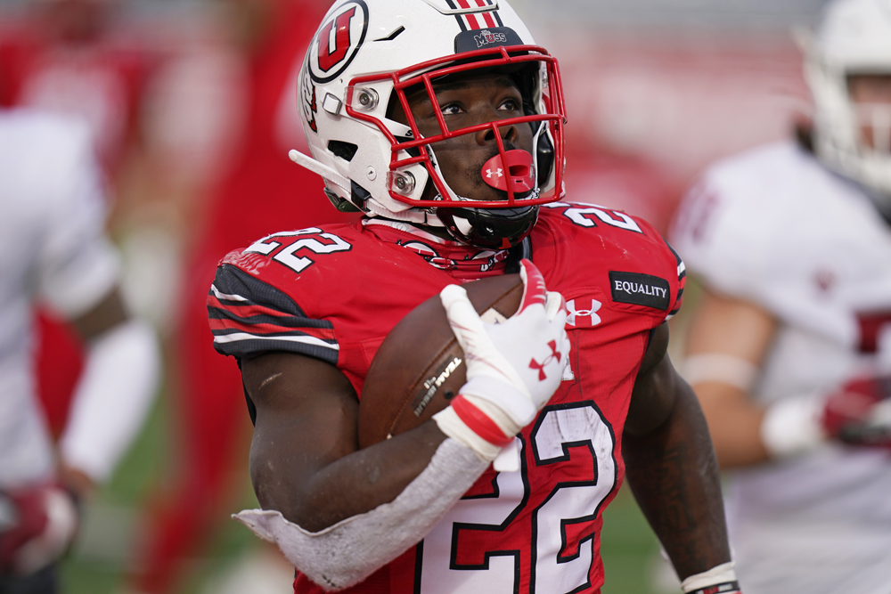 FILE - In this Dec. 19, 2020, file photo, Utah running back Ty Jordan (22) scores against Washington State during the second half of an NCAA college football game, in Salt Lake City. Jordan, a star freshman running back for the University of Utah who grew up in the Dallas area, has died, school officials announced Saturday, Dec. 26. Authorities in Texas and Utah have not released details about the circumstances of the Jordan's death. (AP Photo/Rick Bowmer, File)