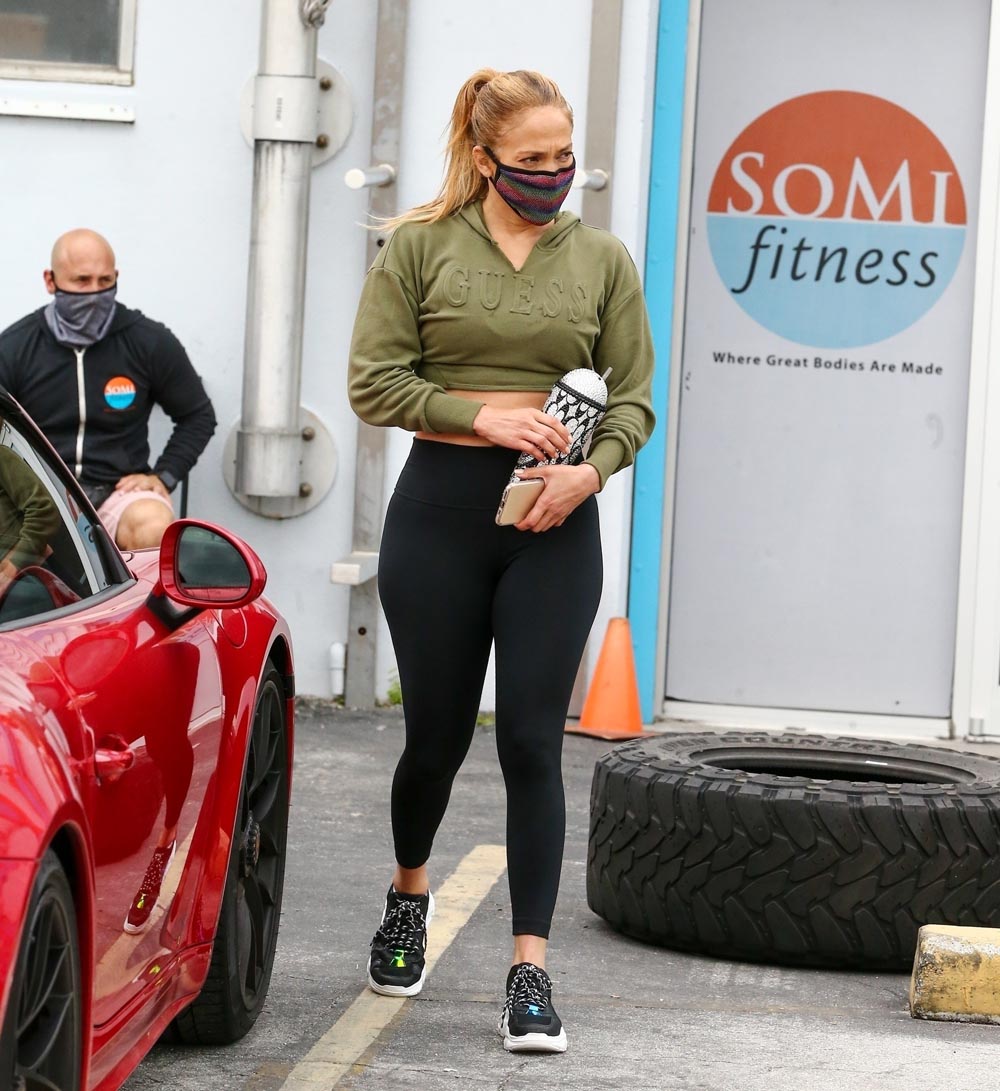 *EXCLUSIVE* Jennifer Lopez wears custom leggings with her kid's names on it on way to gym after a mobile COVID-19 test van exiting was seen exiting her home.