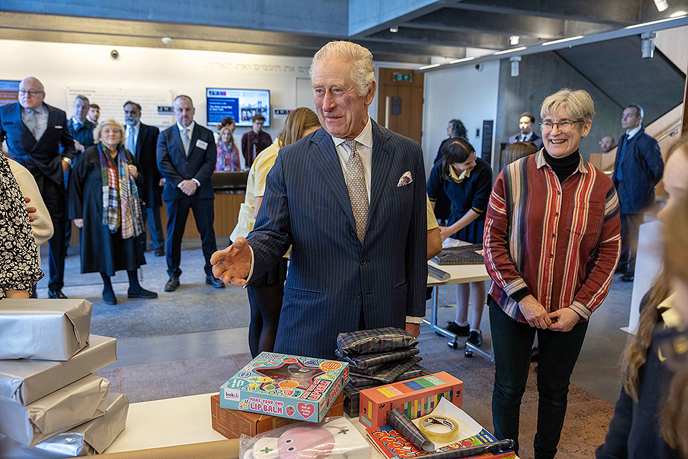 As the Jewish community prepares to celebrate Chanukah, His Majesty King Charles III visited JW3, a Jewish community centre that is open to all faiths and acts as a hub for the arts, culture, social action and learning in North London. Founded by Dame Vivien Duffield DBE, JW3 opened in October 2013 with a vision of a vibrant, diverse, unified British-Jewish community, inspired by and engaged with Jewish arts, culture, learning and life. King Charles III watched local school girls wrap presents
King Charles III visits JW3 Jewish Community Centre, London, UK - 16 Dec 2022