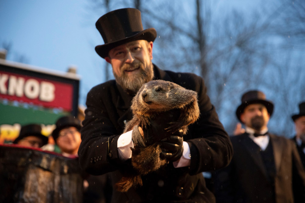 Groundhog Club co-handler Al Dereume holds Punxsutawney Phil, the weather prognosticating groundhog, during the 134th celebration of Groundhog Day on Gobbler's Knob in Punxsutawney, Pa. . Phil's handlers said that the groundhog has forecast an early spring
Groundhog Day, Punxsutawney, USA - 02 Feb 2020