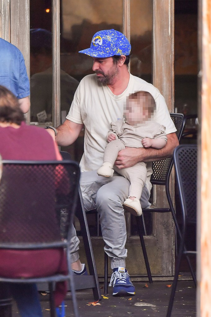 Beau Clark holds daughter Hartford at lunch with Stassi Schroeder