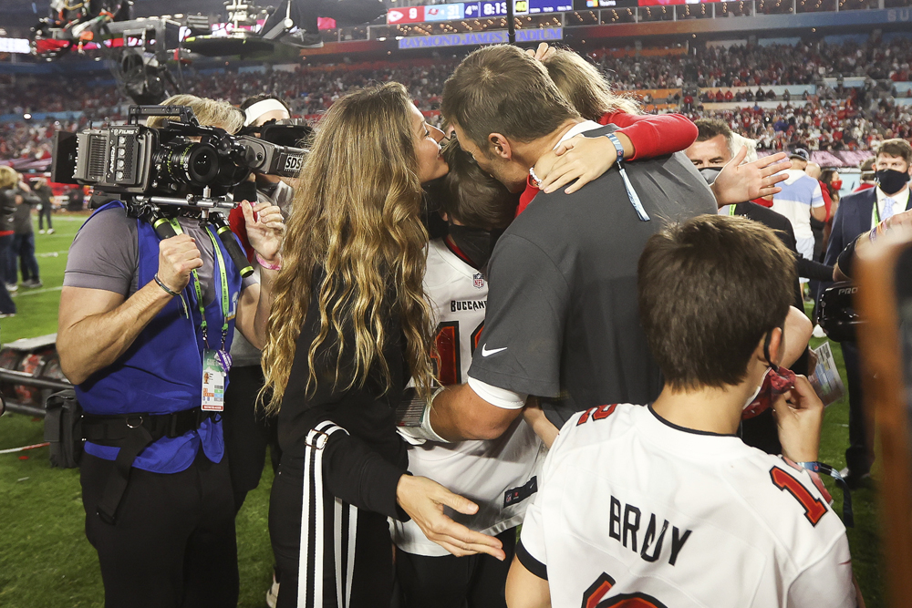 Tampa Bay Buccaneers quarterback Tom Brady (12) celebrates with his family following the NFL Super Bowl 55 football game against the Kansas City Chiefs, Sunday, Feb. 7, 2021 in Tampa, Fla. Tampa Bay won 31-9 to win Super Bowl LV. (Ben Liebenberg via AP)