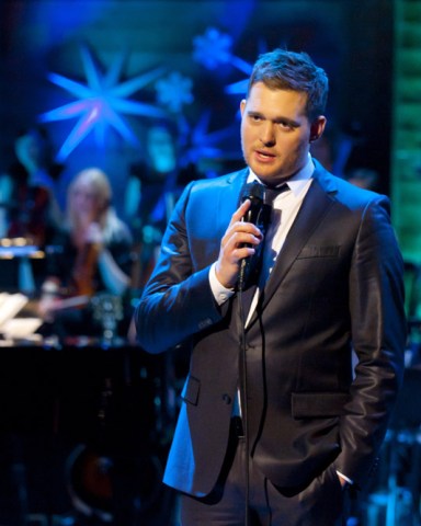 Editorial use only
Mandatory Credit: Photo by ITV/Shutterstock (1536483m)
Michael Buble
'Michael Buble - Home for Christmas' TV Programme - Dec 2011
The Grammy award winning singer songwriter will be sprinkling his unique blend of extraordinary talent and infectious humour in this one off Christmas Special.  
Headlining this exciting new show, Michael will be unwrapping a host of celebrity guests including X Factor judge Gary Barlow and comedienne Dawn French who will be joining the show's festivities, which will see some unmissable duets, including an exclusive performance with The X Factor's Kelly Rowland.  Michael and Kelly will join forces for the first time to sing one of the country's best loved Christmas hits.        
Following the success of his previous ITV shows, An Audience With and This Is Michael Bublé, the critically acclaimed performer will be recreating his own Canadian luxurious winter retreat here in the UK.  Having sold an estimated 30 million albums, the singer will be performing classic seasonal hits from his new album 'Christmas' as well other favourites.   
Other guests include Naturally 7, The Puppini Sisters and Gino D'Acampo