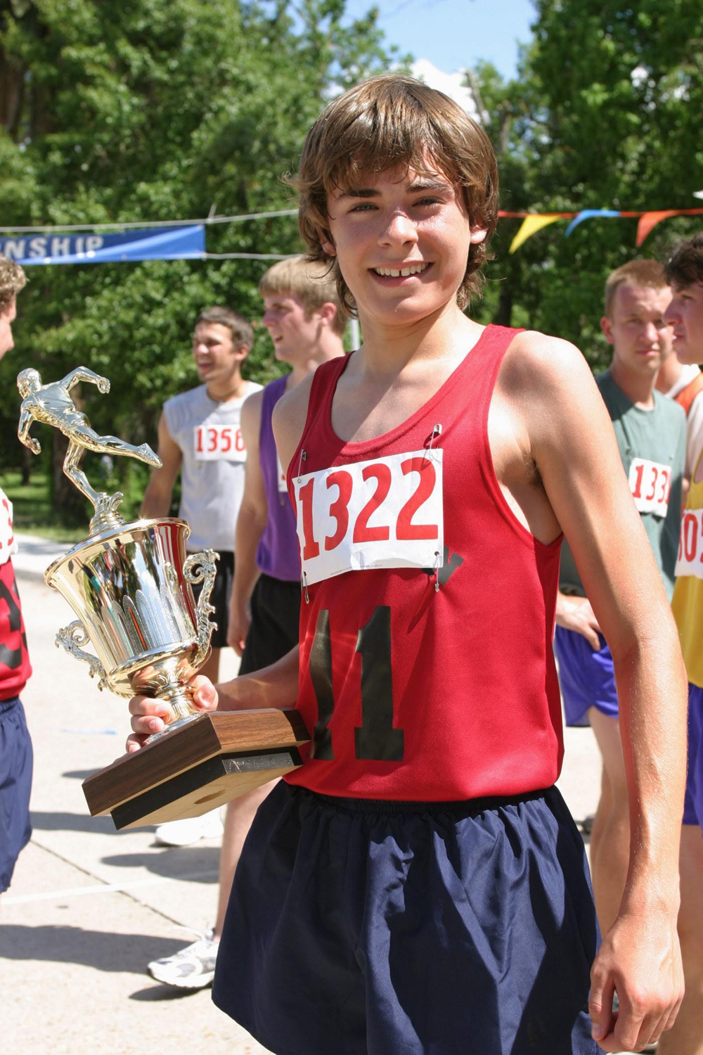 Editorial use only
Mandatory Credit: Photo by ITV/Shutterstock (885411rb)
'Miracle Run'  TV Film -  The Unexpected Journey - Steven Morgan (Zac Efron) carries his trophy.
GTV ARCHIVE