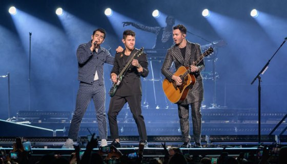 Jonas Brothers performing on stage