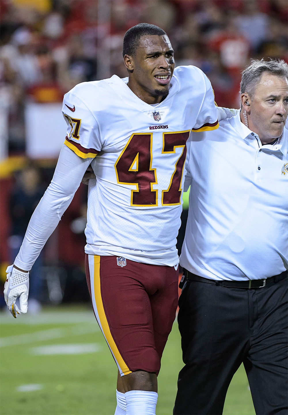 Washington Redskins cornerback Quinton Dunbar (47) is helped off the field during the second half of an NFL football game in Kansas City, Mo
Redskins Chiefs Football, Kansas City, USA - 02 Oct 2017