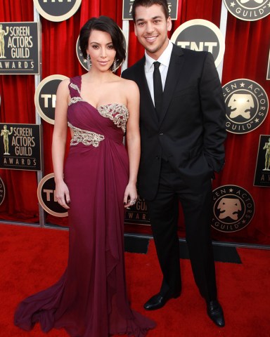 LOS ANGELES, CA - JANUARY 30: Kim Kardashian and Rob Kardashian at the Arrivals for the 17th Annual Screen Actors Guild Awards on January 30, 2011 at the Shrine Auditorium in Los Angeles, California. 
 Arrivals for 17th Annual Screen Actors Guild Awards