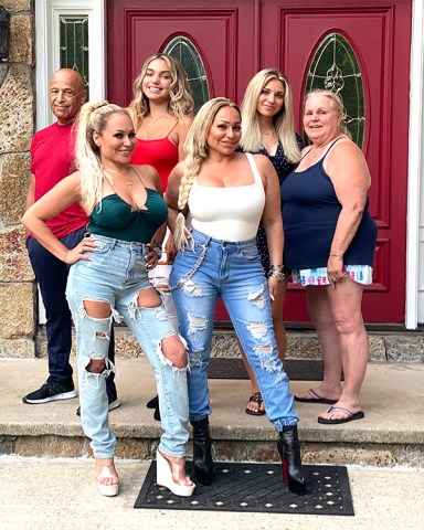 Mike, Aniko, Aspen, Darcey, Stacey and Nancy in front of house