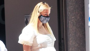 Sophie Turner in a white dress