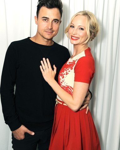 From left, Joe King and Candice Accola arrive at The Hollywood Reporter celebration of the Emmy nominees and new fall TV season presented by Samsung Galaxy, Asos, Porsche, Pandora and Ketel One, on Thursday, Sept. 19, 2013, at Soho House in West Hollywood, Calif. (Photo by Jordan Strauss/Invision for THR/AP Images)