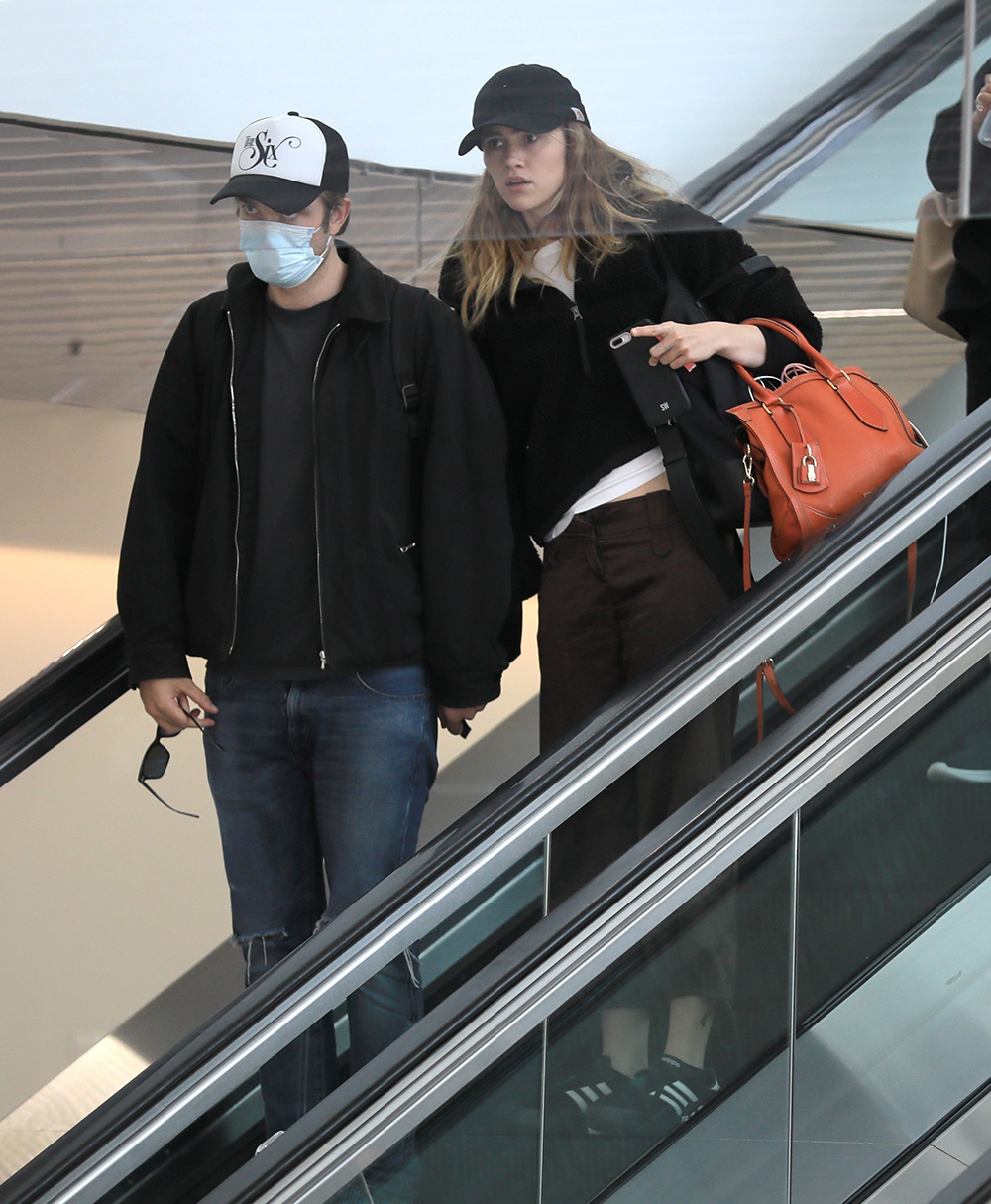 *EXCLUSIVE* British power-couple, Robert Pattinson and Suki Waterhouse make a casual arrival into Los Angeles