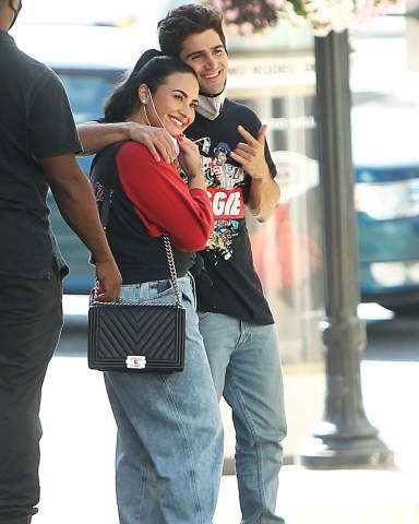 Demi Lovato and her new fiance Max Ehrich look happy in love on Beverly Hills shopping trip. The lovebirds were spotted out and about on Monday afternoon (july 27). Singer Demi was showing off her incredible engagement ring, after her beau popped the question last week during a romantic proposal on a Malibu beach. The loved-up duo couldn't keep their hands off each other, as they cuddled on famous Rodeo Drive and seemed happy to be spotted by photographers. The hit Versace and Persol stores and enjoyed a late lunch at 208 Rodeo Dr, an upscale restaurant with bistro fare & California cuisine.

Pictured: Demi Lovato,Max Ehrich
Ref: SPL5179046 280720 NON-EXCLUSIVE
Picture by: SplashNews.com

Splash News and Pictures
USA: +1 310-525-5808
London: +44 (0)20 8126 1009
Berlin: +49 175 3764 166
photodesk@splashnews.com

World Rights