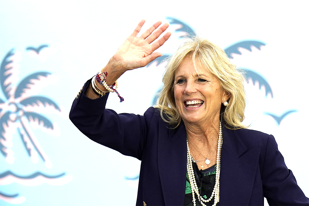 Jill Biden waves to supporters while campaigning for her husband Democratic presidential candidate and former Vice President Joe Biden, during a drive in rally Sunday, Nov. 1, 2020, in Tampa, Fla. (AP Photo/Chris O'Meara)