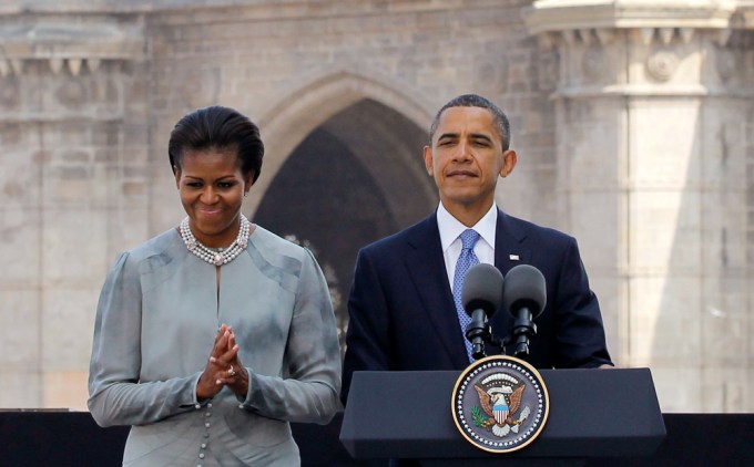 Barack and Michelle Obama visit a memorial for terror attack victims in India