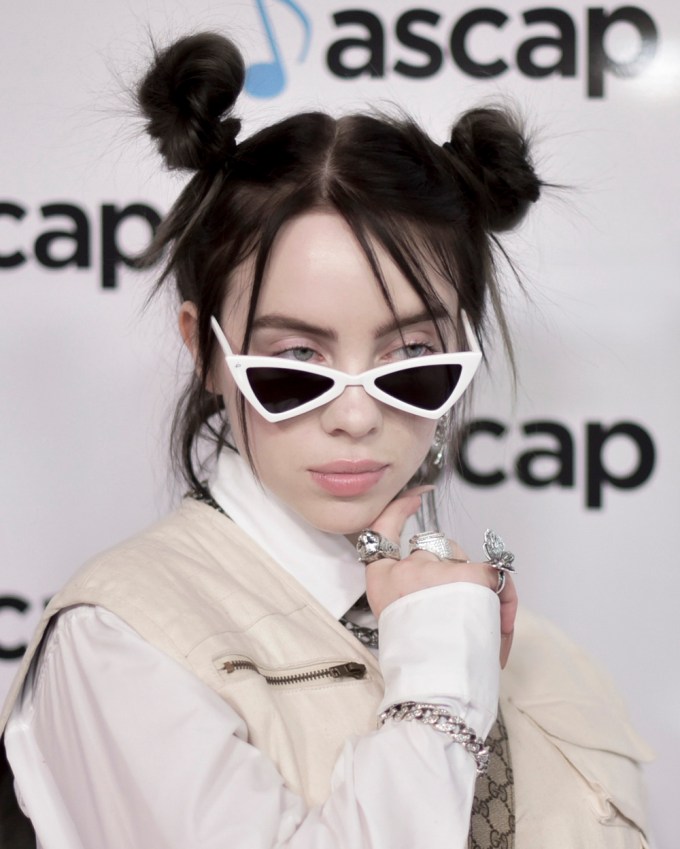 Billie Eilish stuns with two brunette top knots