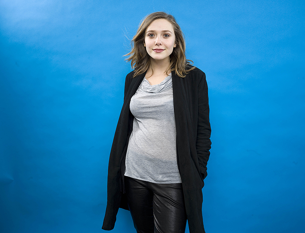 Elizabeth Olsen from the films "Martha Marcy May Marlene" and "Silent House" poses for a portrait in the Fender Music Lodge during the 2011 Sundance Film Festival on Saturday, Jan. 22, 2011 in Park City, Utah.   (AP Photo/Victoria Will)