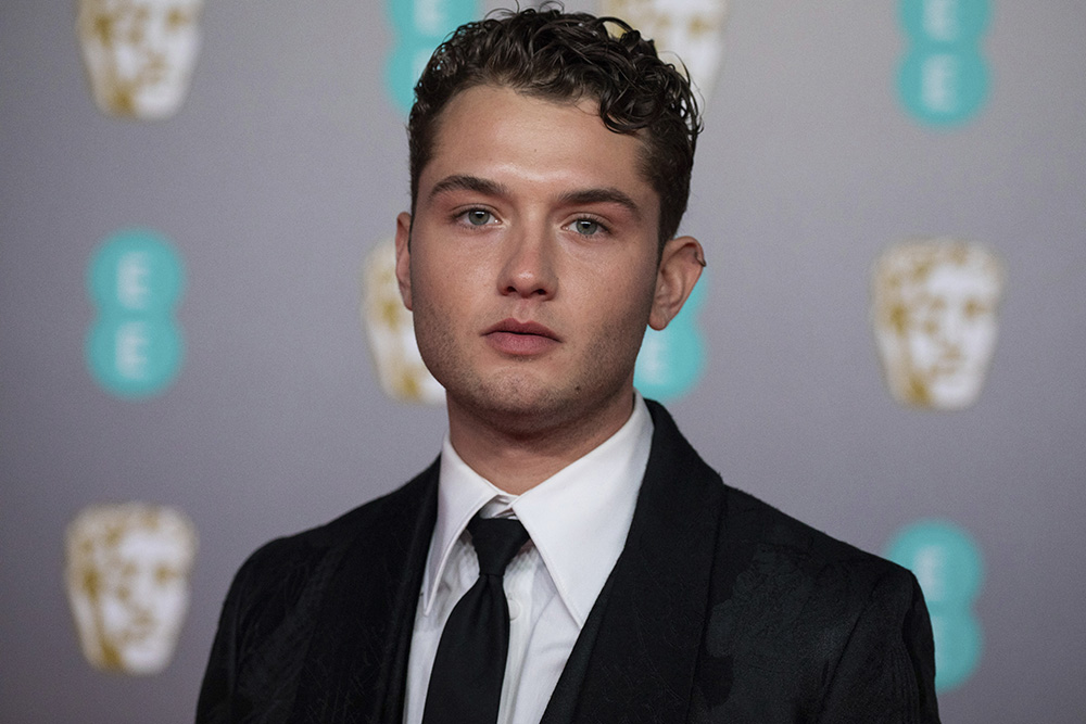 Rafferty Law poses for photographers upon arrival at the Bafta Film Awards, in central London, Sunday, Feb. 2 2020. (Photo by Vianney Le Caer/Invision/AP)