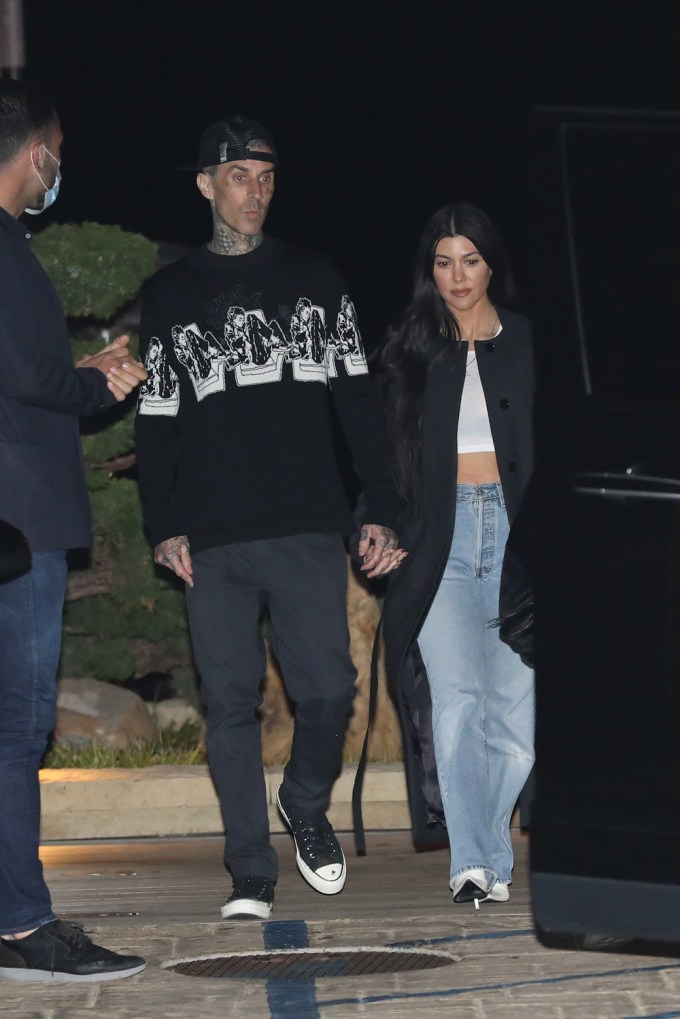 Kourtney Kardashian & Travis Barker hold hands