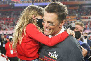 Tampa Bay Buccaneers quarterback Tom Brady (12) celebrates with his family following the NFL Super Bowl 55 football game against the Kansas City Chiefs, Sunday, Feb. 7, 2021 in Tampa, Fla. Tampa Bay won 31-9 to win Super Bowl LV. (Ben Liebenberg via AP)