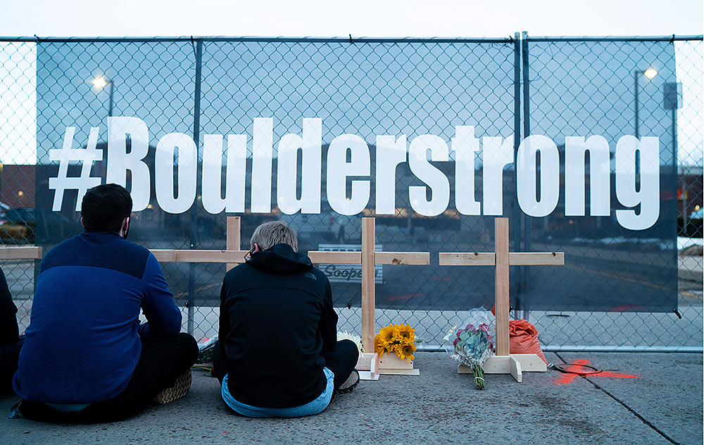 People lay flowers at a growing memorial at the scene a day after Ahmad Al Aliwi Alissa allegedly to have killed ten people including a police officer, at the King Soopers supermarket in Boulder, Colorado, USA, 23 March 2021. Boulder Police released the names of all ten victims as Denny Strong, 20, Neven Stanisic, 23, Rikki Olds, 25, Tralona Bartkowiak, 49, Suzanne Fountain, 59, Teri Leiker, 51, Eric Talley, 51, Kevin Mahoney, 61, Lynn Murray, 62 and Jody Waters, 65.Aftermath of mass shooting in Colorado, Boulder, USA - 23 Mar 2021