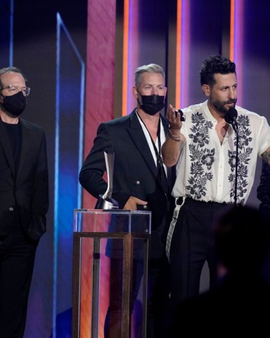 Matthew Ramsey, second from right, and members of Old Dominion, accept the award for group of the year at the 56th annual Academy of Country Music Awards, at the Grand Ole Opry in Nashville, Tenn
2021 Academy of Country Music Awards, Nashville, United States - 18 Apr 2021