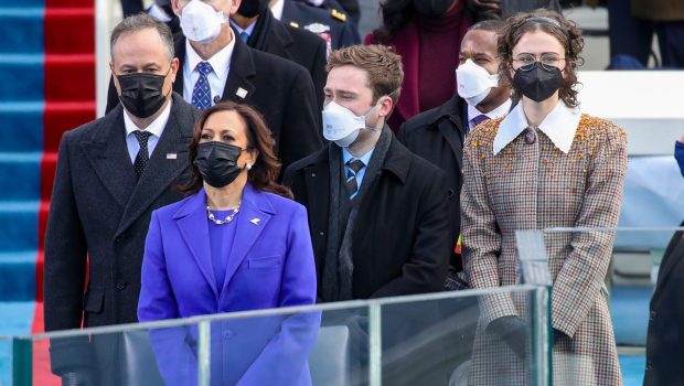 WASHINGTON, DC - JANUARY 20: Doug Emhoff (from left), Vice President Elect Kamala Harris, Cole Emhoff,  Ella Emhoff, and Vice President Mike Pence stand as Lady Gaga sings the National Anthem at the inauguration of U.S. President-elect Joe Biden on the West Front of the U.S. Capitol on January 20, 2021 in Washington, DC.  During today's inauguration ceremony Joe Biden becomes the 46th president of the United States. (Photo by Win McNamee/Getty Images)