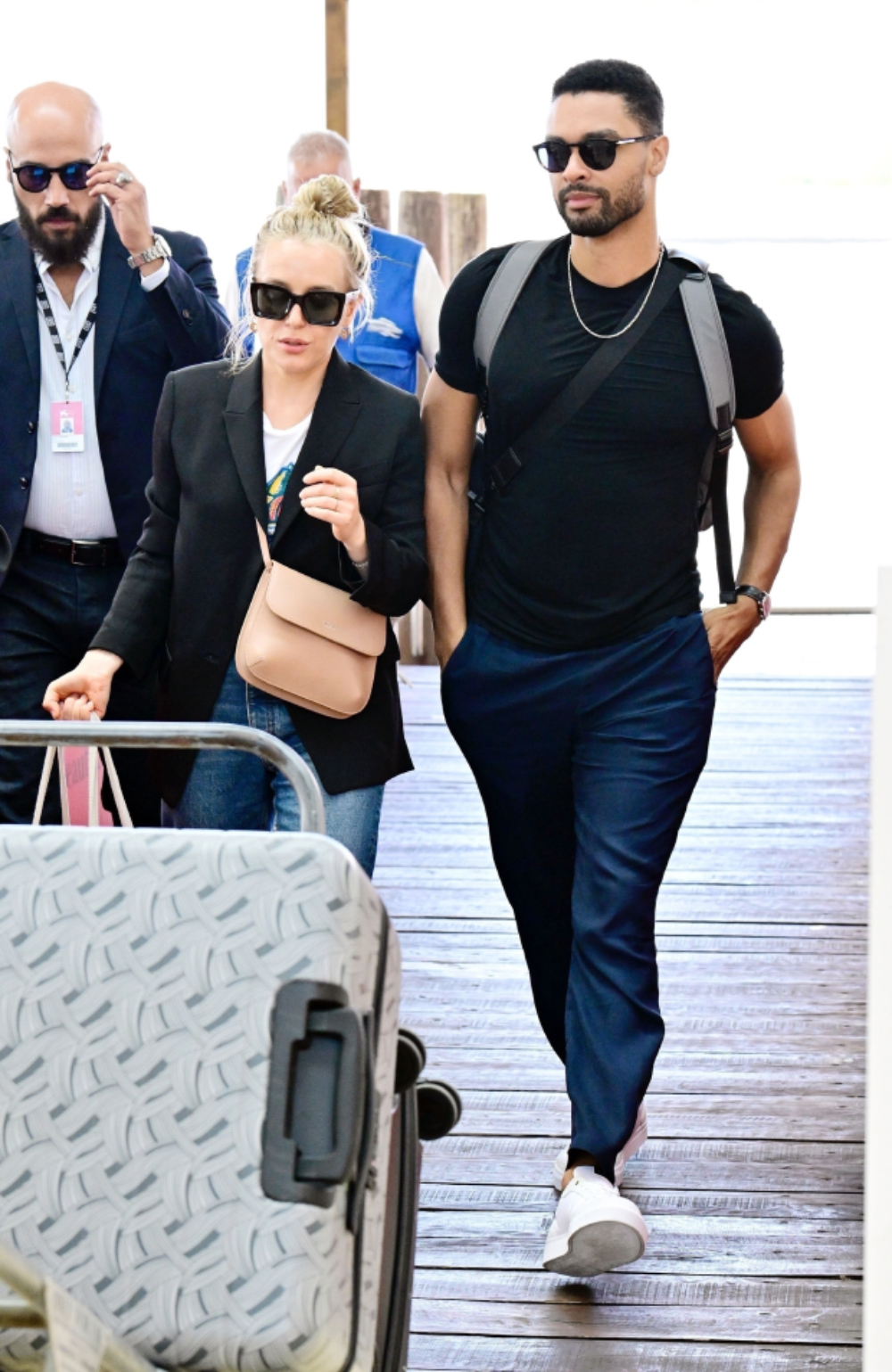 *EXCLUSIVE* 'Bridgerton' actor Rege-Jean Page looks suave while with girlfriend Emily Brown leaving the Venice Airport!