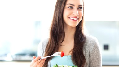 Woman eating fruit